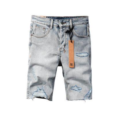 Men's Vintage Light Wash Ripped Denim Shorts with Raw Cut Hem and Distressed Details 2003