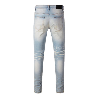 Men’s Light Blue Skinny Jeans with Heavy Distressing and Colorful Pink Patchwork Accents for a Bold Summer Look 589
