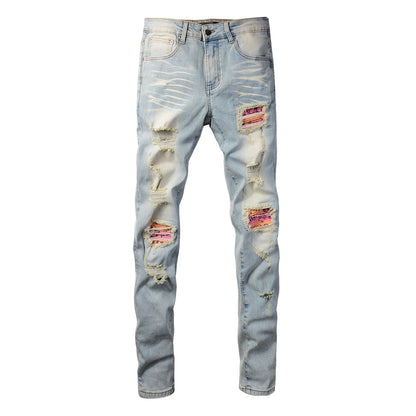Men’s Light Blue Skinny Jeans with Heavy Distressing and Colorful Pink Patchwork Accents for a Bold Summer Look 589