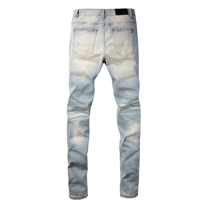 Men’s Light Blue Skinny Jeans with Heavy Distressing and Colorful Pink Patchwork Accents for a Bold Summer Look 589