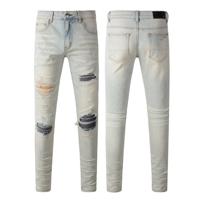 Men’s Light Washed Skinny Jeans with Heavy Ripped Details and Dark Contrast Patchwork for a Vintage Street Look 699