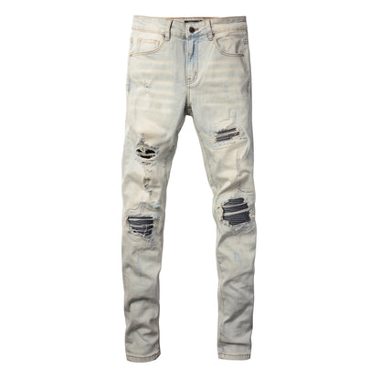 Men’s Light Washed Skinny Jeans with Heavy Ripped Details and Dark Contrast Patchwork for a Vintage Street Look 699