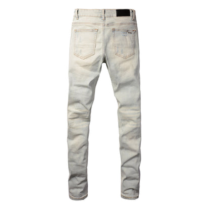 Men’s Light Washed Skinny Jeans with Heavy Ripped Details and Dark Contrast Patchwork for a Vintage Street Look 699