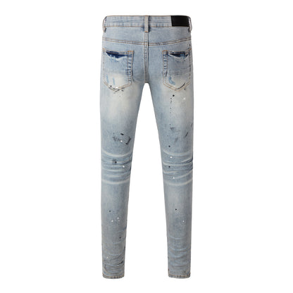 Men’s Light Blue Skinny Jeans with Paint Splatter, Heavy Rips, and Gradient Washed Effect 8899