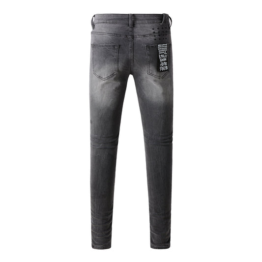 Urban Gray Ripped Jeans with Bold Black Graffiti Accents 3003