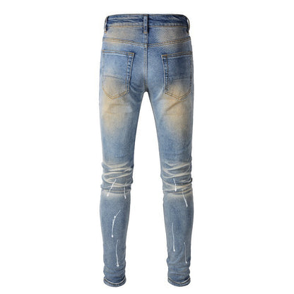 Men's Blue Jeans with Black Patches, Distressed Paint, and Ripped Details (523-6523)